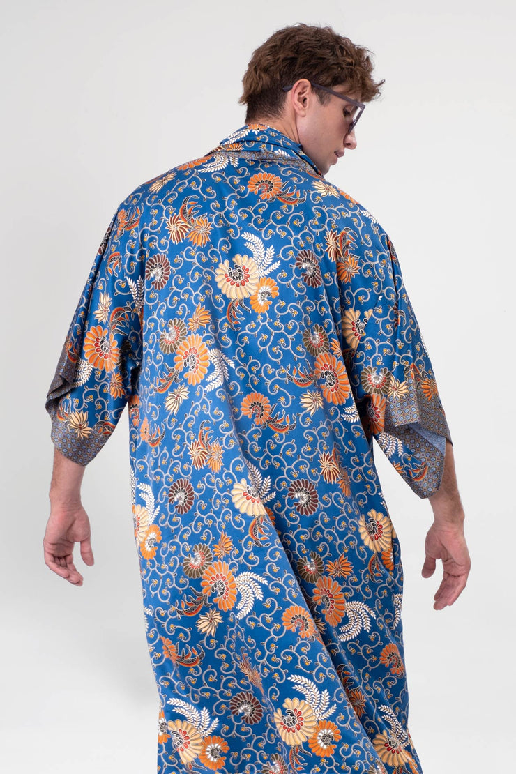Close-up of the vibrant Birds and Bees Full-Length Kimono fabric, showcasing the rich blue color and intricate design.